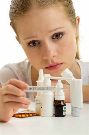 simsearch:6109-08396647,k - Young woman having flu with thermometer and pills on a white background Foto de stock - Super Valor sin royalties y Suscripción, Código: 400-05750784