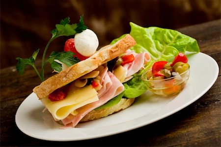 fast food salad - photo of delicious toast stuffed with cheese and ham with lettuce and parsley Stock Photo - Budget Royalty-Free & Subscription, Code: 400-05750800