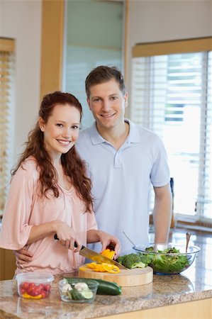 simsearch:6109-06194424,k - Male watching his girlfriend preparing a green salad Stock Photo - Budget Royalty-Free & Subscription, Code: 400-05751146