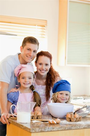 Happy smiling family with baking ingredients Stock Photo - Budget Royalty-Free & Subscription, Code: 400-05751227