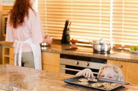 simsearch:400-05749772,k - Cheeky boy sneaking up to cookies Stock Photo - Budget Royalty-Free & Subscription, Code: 400-05751247