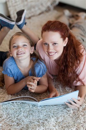 simsearch:400-05751566,k - Mother and daughter on the floor reading together Stock Photo - Budget Royalty-Free & Subscription, Code: 400-05751551