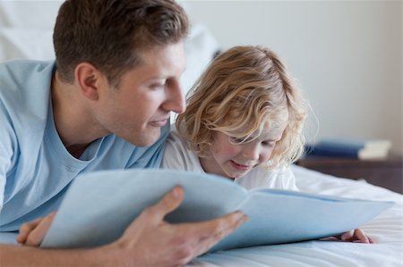 simsearch:400-05751566,k - Father and son reading together Stock Photo - Budget Royalty-Free & Subscription, Code: 400-05751567