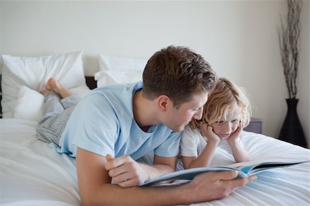 simsearch:400-05751566,k - Father doing reading exercises together with his son Stock Photo - Budget Royalty-Free & Subscription, Code: 400-05751568