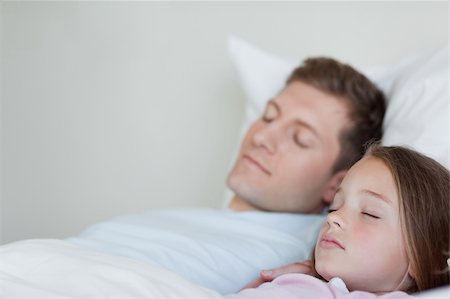 Side view of father and daughter asleep together Stock Photo - Budget Royalty-Free & Subscription, Code: 400-05751577