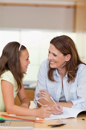 simsearch:400-05751679,k - Woman doing homework together with her daughter Stock Photo - Budget Royalty-Free & Subscription, Code: 400-05751671
