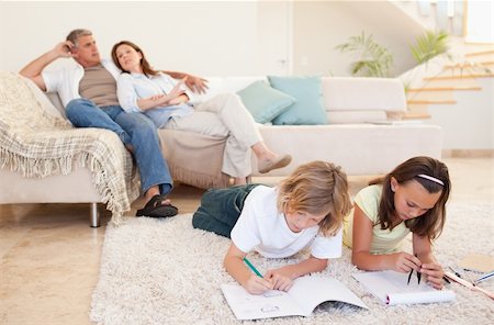 simsearch:400-05751676,k - Brother and sister doing their homework on the carpet Stock Photo - Budget Royalty-Free & Subscription, Code: 400-05751855