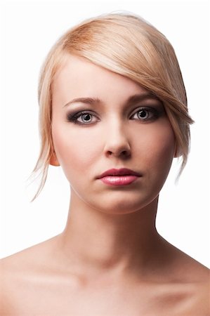 simsearch:400-05744994,k - close up beauty portrait of a young and cute blond girl with hair style over white, she is in front of the camera and looks in to the lens Stock Photo - Budget Royalty-Free & Subscription, Code: 400-05752506