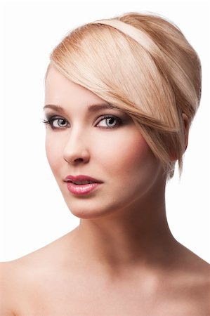 simsearch:400-05744994,k - close up beauty portrait of a young and cute blond girl with hair style over white. her face is turned three-quarters, she looks in to the lens and smiles Stock Photo - Budget Royalty-Free & Subscription, Code: 400-05752507