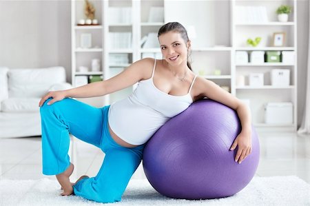 A pregnant woman with a ball at home Stock Photo - Budget Royalty-Free & Subscription, Code: 400-05753084