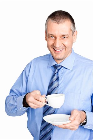 A handsome business man with a white cup of coffee Stock Photo - Budget Royalty-Free & Subscription, Code: 400-05753097