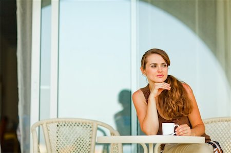 simsearch:400-05753456,k - Thoughtful woman sitting on terrace and having cup of coffee Foto de stock - Super Valor sin royalties y Suscripción, Código: 400-05753447