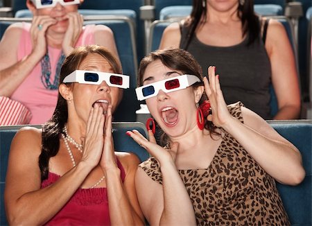 simsearch:400-06138368,k - Two amazed Caucasian women with 3D glasses Fotografie stock - Microstock e Abbonamento, Codice: 400-05753825