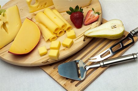 simsearch:400-05682309,k - A set of different cheeses, strawberry, pear and special cheese knives on a wooden board Stock Photo - Budget Royalty-Free & Subscription, Code: 400-05875334