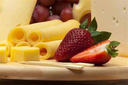 simsearch:400-05682309,k - A set of different cheeses, strawberry and grapes on a wooden board Stock Photo - Budget Royalty-Free & Subscription, Code: 400-05875333