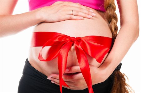 simsearch:400-04859723,k - pregnant woman with red silk bow on stomach Fotografie stock - Microstock e Abbonamento, Codice: 400-05875633