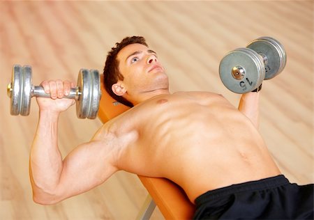 simsearch:400-05273035,k - Handsome man at the gym doing exercises Stock Photo - Budget Royalty-Free & Subscription, Code: 400-05875706