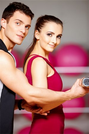 simsearch:400-05875765,k - Sporty couple exercising at the fitness gym Stock Photo - Budget Royalty-Free & Subscription, Code: 400-05875700