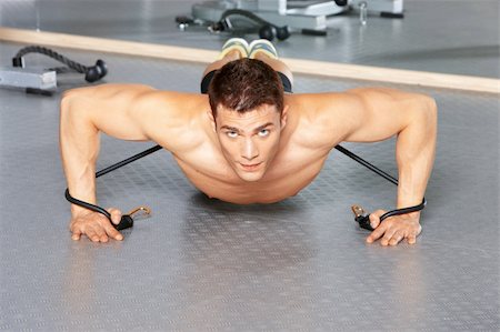 simsearch:400-05875765,k - Handsome man at the gym doing exercises Stock Photo - Budget Royalty-Free & Subscription, Code: 400-05875726