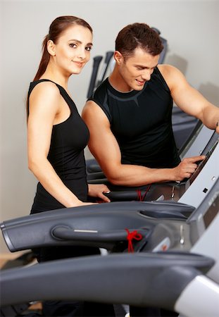 simsearch:400-05875765,k - Sporty couple exercising at the fitness gym Stock Photo - Budget Royalty-Free & Subscription, Code: 400-05875767