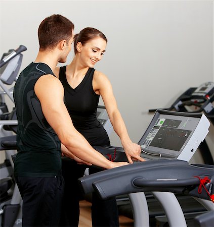 simsearch:400-05875765,k - Sporty couple exercising at the fitness gym Stock Photo - Budget Royalty-Free & Subscription, Code: 400-05875761