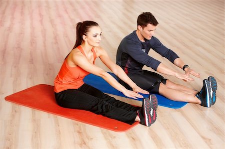 simsearch:400-05875765,k - Sporty couple exercising at the fitness gym Stock Photo - Budget Royalty-Free & Subscription, Code: 400-05875772