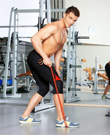 simsearch:400-05910572,k - Handsome man at the gym doing exercises Fotografie stock - Microstock e Abbonamento, Codice: 400-05875784