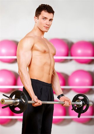 simsearch:400-05910572,k - Handsome man at the gym doing exercises Fotografie stock - Microstock e Abbonamento, Codice: 400-05875780