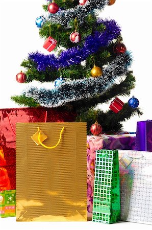 decorated christmas tree with gifts cut out from white background Stock Photo - Budget Royalty-Free & Subscription, Code: 400-05876034