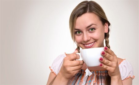 Smiling lovely young blonde with a cup of tea. Stockbilder - Microstock & Abonnement, Bildnummer: 400-05876594