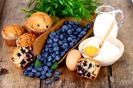 simsearch:400-06698338,k - Muffins with blueberry, egg, flour and milk on wooden table Stock Photo - Budget Royalty-Free & Subscription, Code: 400-05876858
