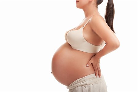 Beautiful young pregnant woman, isolated on white Stockbilder - Microstock & Abonnement, Bildnummer: 400-05876945
