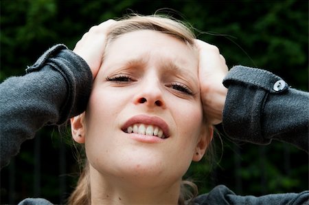 people in panic - Young panic woman with hands on the head Stock Photo - Budget Royalty-Free & Subscription, Code: 400-05877004