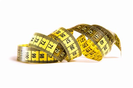 Whirled yellow tape measure isolated on white Stock Photo - Budget Royalty-Free & Subscription, Code: 400-05877759