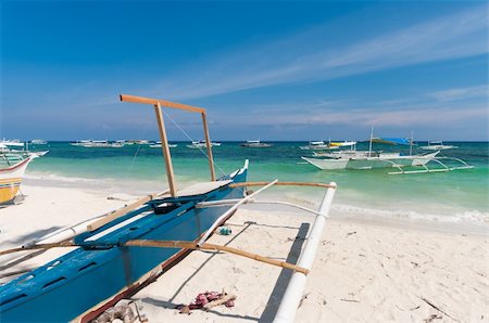 philippines outrigger canoe - traditional philippine bangkas on a beach in Alona, Bohol Stock Photo - Budget Royalty-Free & Subscription, Code: 400-05877855