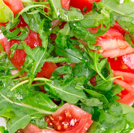 Healthy vegetarian Salad with rucola and  tomatoes on the white plate Stock Photo - Budget Royalty-Free & Subscription, Code: 400-05878034