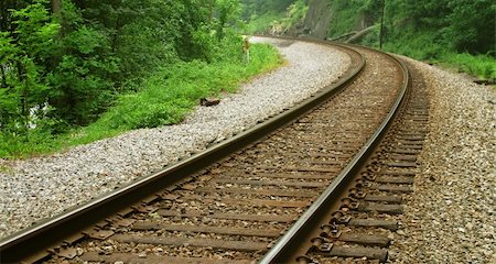simsearch:400-03977018,k - A curved section of railroad tracks in an isolated wooded area. Stock Photo - Budget Royalty-Free & Subscription, Code: 400-05878257