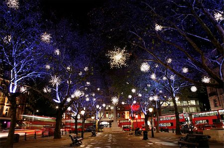 Christmas Lights Display on Sloane Square in Chelsea, London. The modern colourful Christmas lights attract and encourage people to the street. Stock Photo - Budget Royalty-Free & Subscription, Code: 400-05878264