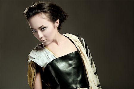 Modern fashionable brunette japanese woman over gray Stockbilder - Microstock & Abonnement, Bildnummer: 400-05878787