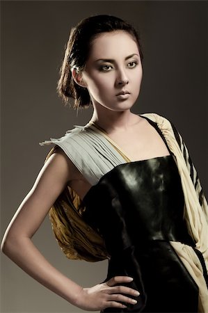 Modern fashionable brunette japanese woman over gray Stockbilder - Microstock & Abonnement, Bildnummer: 400-05878789