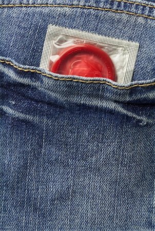 Condom in the blue jeans pocket Stock Photo - Budget Royalty-Free & Subscription, Code: 400-05878903