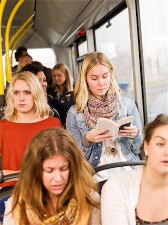 Woman on the bus reading a book Stock Photo - Budget Royalty-Free & Subscription, Code: 400-05884029