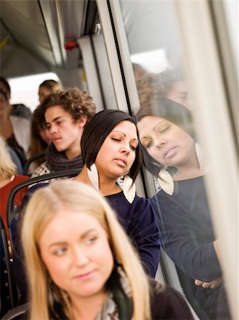 sleep train - Woman sleeping while going by the bus Stock Photo - Budget Royalty-Free & Subscription, Code: 400-05884036