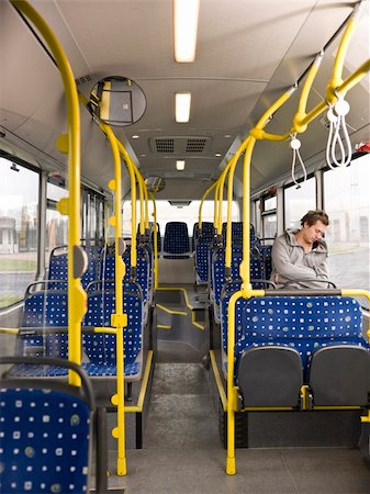 Young man sleeping on the bus Stock Photo - Budget Royalty-Free & Subscription, Code: 400-05884141