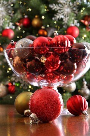 Christmas ornaments on table in front of holiday tree Stock Photo - Budget Royalty-Free & Subscription, Code: 400-05884778