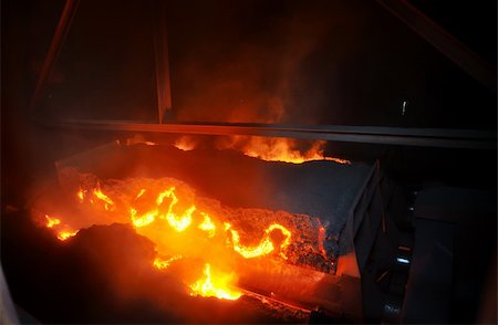 sparks of molten metal - hot ore on conveyor Stock Photo - Budget Royalty-Free & Subscription, Code: 400-05886087