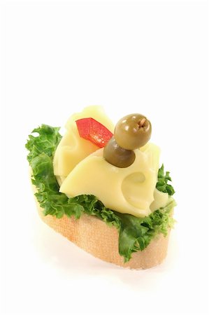 photooasis (artist) - Canape with lettuce, cheese, peppers and olives Stockbilder - Microstock & Abonnement, Bildnummer: 400-05886379