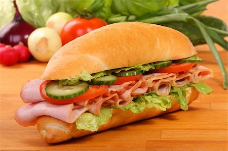 simsearch:400-07792940,k - Delicious ham, cheese and salad sandwiches on a wooden board Stock Photo - Budget Royalty-Free & Subscription, Code: 400-05886417