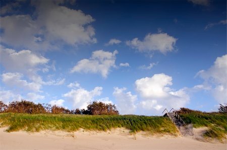 simsearch:400-08223992,k - Coastal dunes and stairs leading up covered with sea sand. Blue sky with clouds. Stock Photo - Budget Royalty-Free & Subscription, Code: 400-05886817