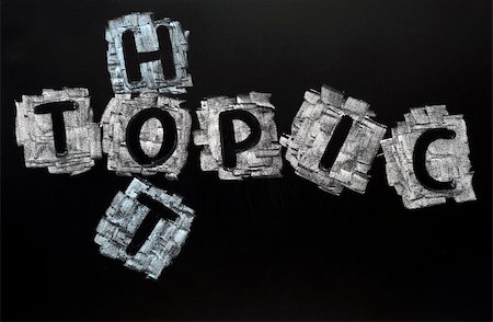 Crossword of Hot Topic written in chalk on a blackboard Stock Photo - Budget Royalty-Free & Subscription, Code: 400-05886963